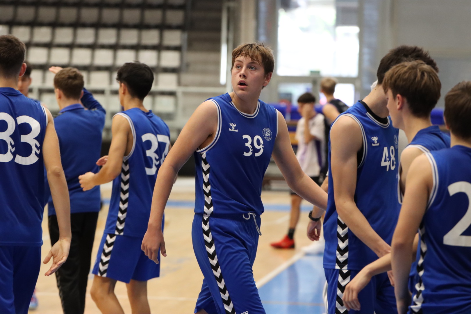 Pawel playing basketball with Lucentum Alicante teammates.